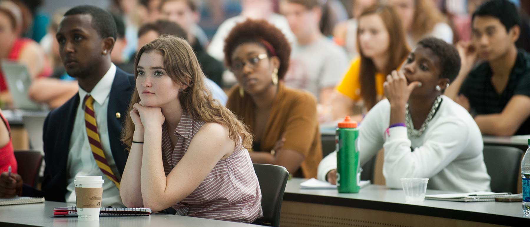 Students looking curious and attentive during a lecture.