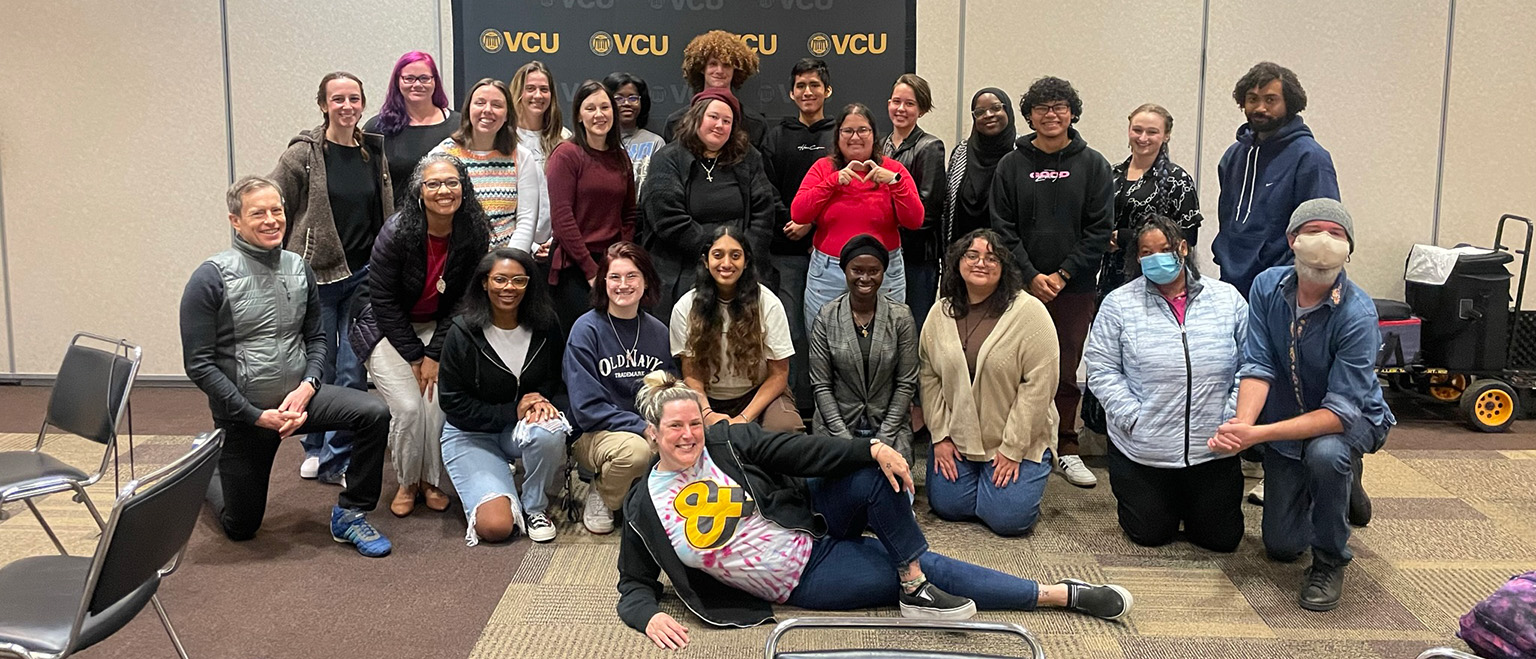 A group of Mellon Pathways Program participants pose in a conference room